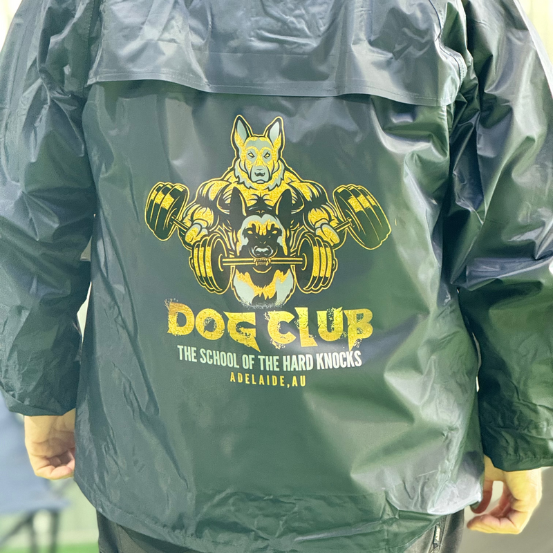 Blue raincoat with 'Dog Club' graphic and text on the back